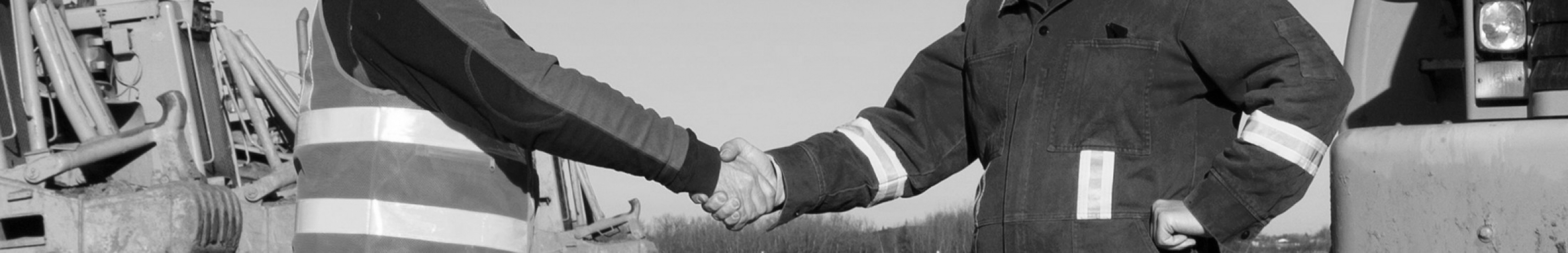 Sears Articulated Dump Truck products. Picture of two men shaking hands in front of articulated dump trucks.
