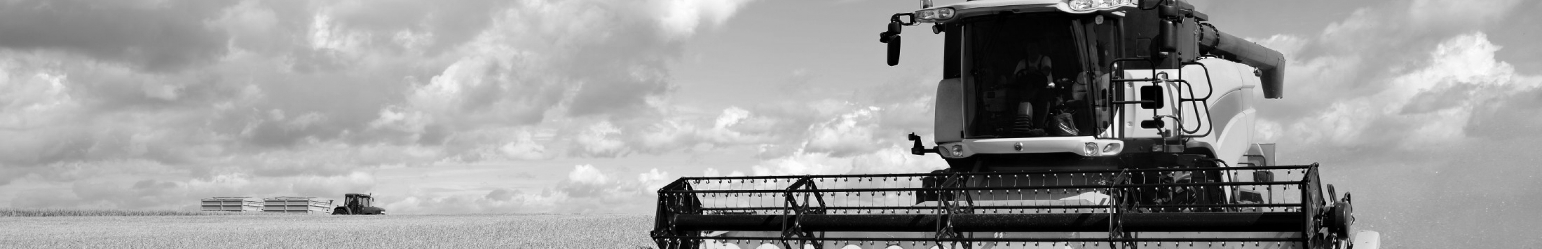 Sears Combines, Harvesters and Sprayers Seating Products. Picture of a combine harvesting wheat.