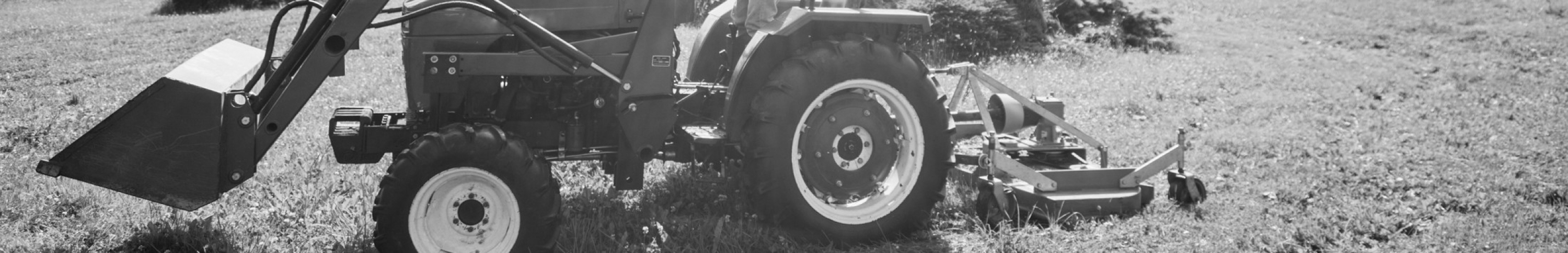 Sears Compact Utility Seating Products. Picture of a compact tractor mowing grass.