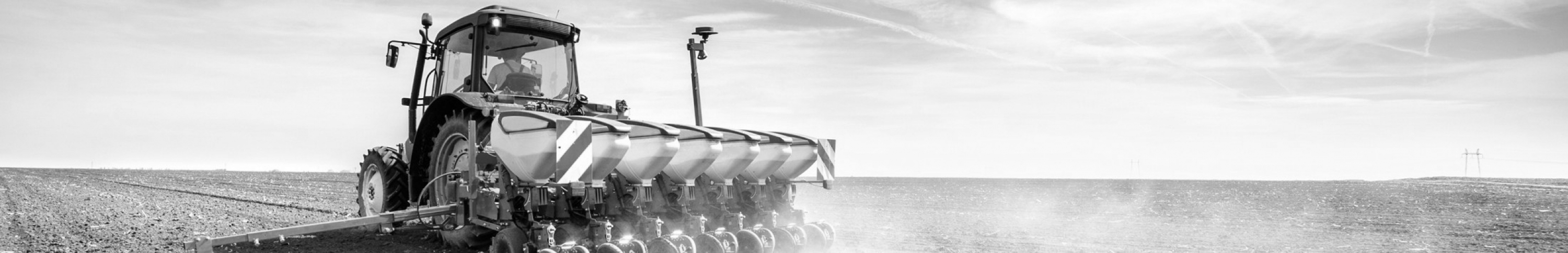 Sears Industries Served. Picture of a tractor planting a field.