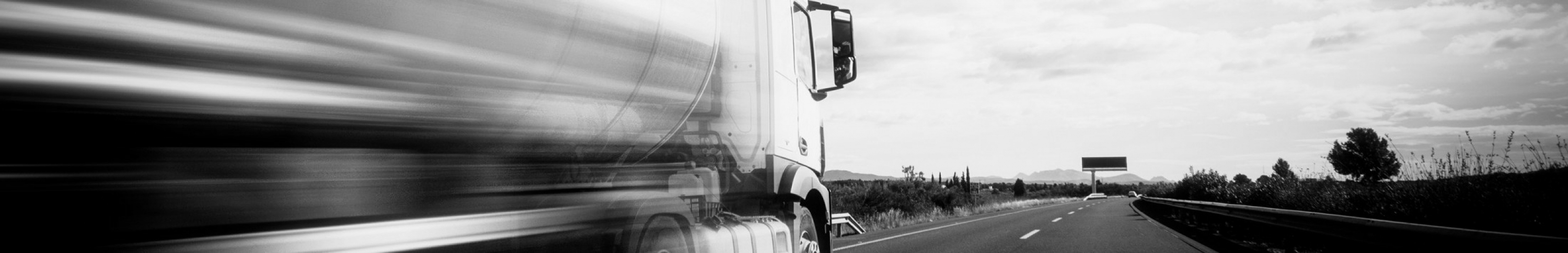 Sears Over the Road Trucking seating solutions. Picture of a truck speeding down the highway.