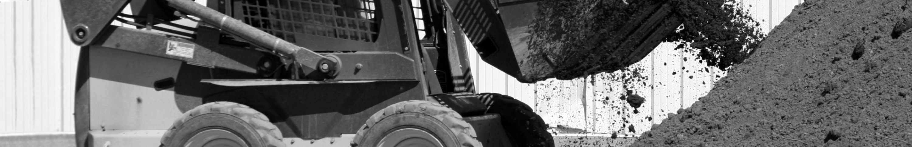 Sears Skid Steer products. Picture of a skid steer picking up dirt.
